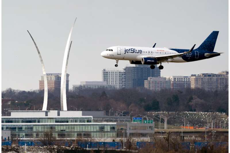 A JetBlue passenger flight lands at Reagan Washington National Airport in Arlington, Va., across the Potomac River from Washington, Wed., Jan. 19, 2022. Transportation Secretary Pete Buttigieg is warning airlines to be ready when wireless companies power up their 5G service next month. Buttigieg told an airline trade group Friday, June 23, 2023, that planes won't be allowed to land in poor visibility if they lack equipment to avoid radio interference from 5G. On July 1, AT&T, Verizon and other wireless carriers will be free to boost the power of their 5G signals. Credit: AP Photo/J. Scott Applewhite, File Buttigieg warns airlines to finish retrofitting planes to avoid interference from 5G signals