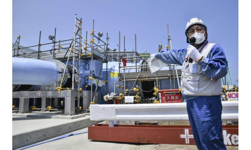 Fukushima nuclear plant operator says equipment to release treated wastewater into sea is complete
