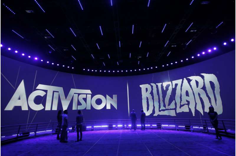 The Activision Blizzard Booth is shown on June 13, 2013, during the Electronic Entertainment Expo in Los Angeles. Microsoft CEO Satya Nadella is due in court Wednesday, June 28, 2023, to defend the company's proposed $69 billion takeover of video game maker Activision Blizzard against an attempt by federal regulators to block the deal. Credit: AP Photo/Jae C. Hong, File Microsoft CEO Satya Nadella to defend planned takeover of game-maker Activision Blizzard in court