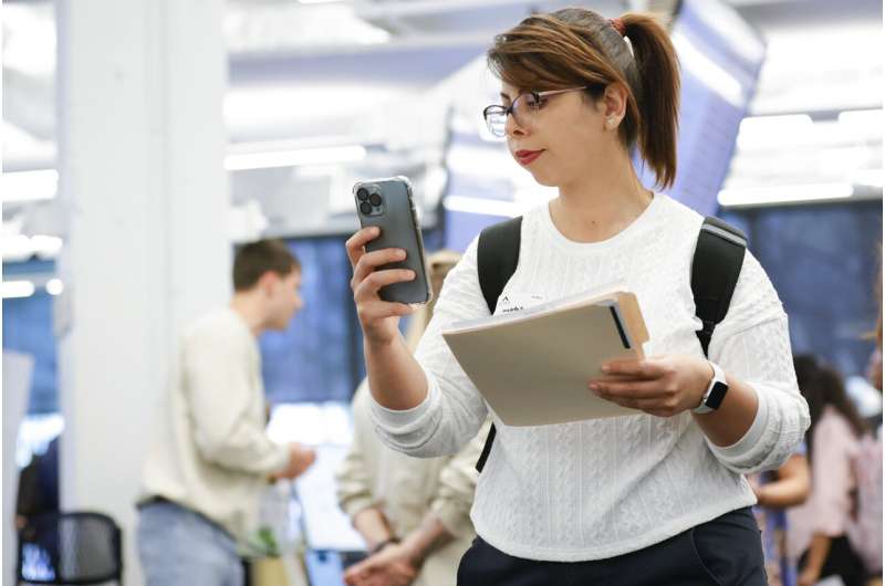 Mahtad Parsamehr, of Atlanta, checks her phone while handing out resumes during the Startup Student Connection job fair, Wednesday, March 29, 2023, in Atlanta. For the thousands of workers who'd never experienced upheaval in the tech sector, the recent mass layoffs at companies like Google, Microsoft, Amazon and Meta came as a shock. Now they are being courted by long-established employers whose names aren't typically synonymous with tech work, including hotel chains, retailers, investment firms, railroad companies and even the Internal Revenue Service. Credit: AP Photo/Alex Slitz Still hiring: Big Tech layoffs give other sectors an opening