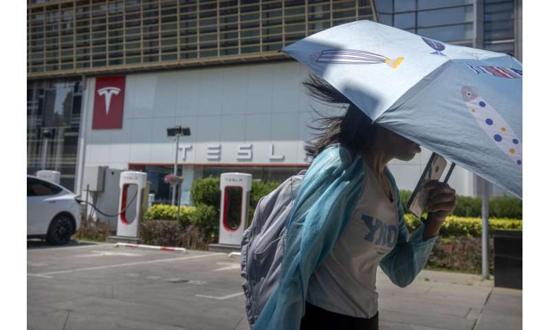 Threatened by shortages, electric car makers race for supplies of lithium for batteries