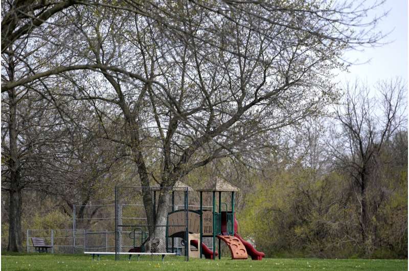A playground sits unused outside Jana Elementary School on Friday, April 7, 2023, in Florissant, Mo. The school has been permanently closed due to its proximity to Coldwater Creek which was contaminated with nuclear material during work on the Manhattan Project. Credit: AP Photo/Jeff Roberson How America’s push for the atomic bomb spawned enduring radioactive waste problems in St. Louis