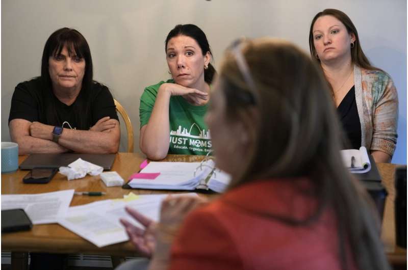 Co-founders of Just Moms STL, Karen Nickel, left, and Dawn Chapman listen along with Ashley Bernaugh, right, as Missouri Rep. Tricia Byrnes, foreground, discusses nuclear contamination in and around the St. Louis area Friday, April 7, 2023, in Maryland Heights, Mo. Credit: AP Photo/Jeff Roberson How America’s push for the atomic bomb spawned enduring radioactive waste problems in St. Louis