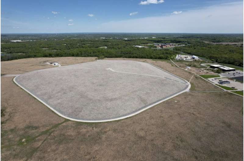 Weldon Spring disposal cell, 41-acre structure built to contain chemical and radiological waste, is visible on Friday, April 21, 2023, in Weldon Spring, Mo. The government said the site is safe, but some local residents still worry. Credit: AP Photo/Jeff Roberson How America’s push for the atomic bomb spawned enduring radioactive waste problems in St. Louis