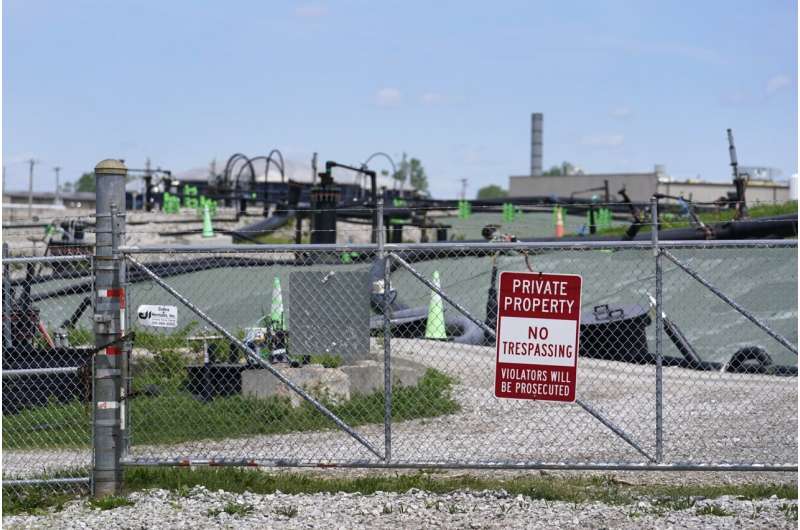 A no trespassing sign hangs on a fence around the West Lake Landfill Superfund site on Friday, April 21, 2023, in Bridgeton, Mo. Federal officials plan to remove some of the hazardous leached barium sulfate that is at the landfill and cap the rest. Credit: AP Photo/Jeff Roberson How America’s push for the atomic bomb spawned enduring radioactive waste problems in St. Louis