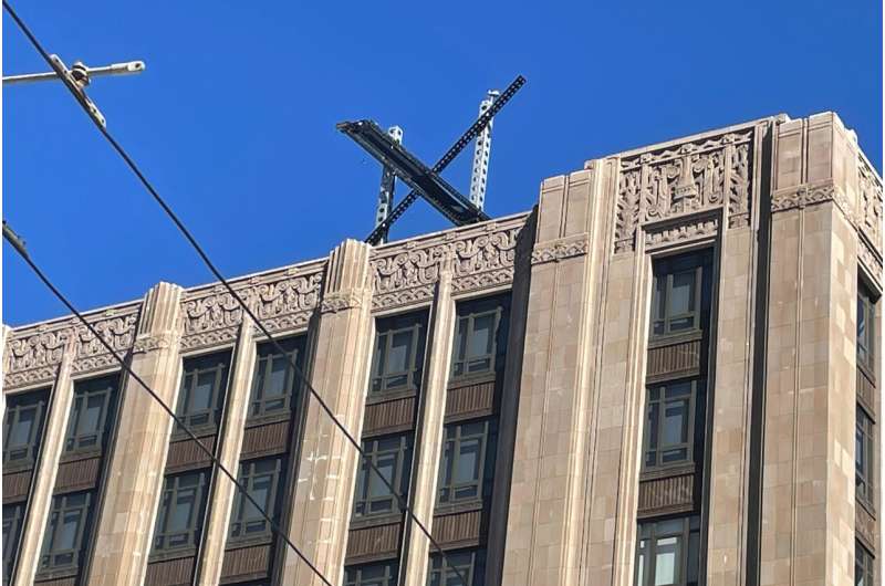 A large, metal "X" sign is seen on top of the downtown building that housed what was once Twitter, now rebranded by its owner, Elon Musk, in San Francisco, Friday, July 28, 2023. The new metal X marker appeared after police stopped workers on Monday, July 24, from removing the iconic bird and logo, saying they didn't have the proper permits and didn't tape off the sidewalk to keep pedestrians safe if anything fell. Credit: AP Photo/Haven Daley Musk threatens to sue researchers who documented the rise in hateful tweets