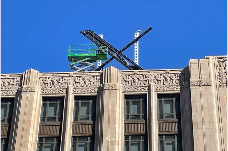 A large, metal "X" sign is seen on top of the downtown building that housed what was once Twitter, now rebranded by its owner, Elon Musk, in San Francisco, Friday, July 28, 2023. The new metal X marker appeared after police stopped workers on Monday, July 24, from removing the iconic bird and logo, saying they didn't have the proper permits and didn't tape off the sidewalk to keep pedestrians safe if anything fell. Credit: AP Photo/Haven Daley Musk threatens to sue researchers who documented the rise in hateful tweets