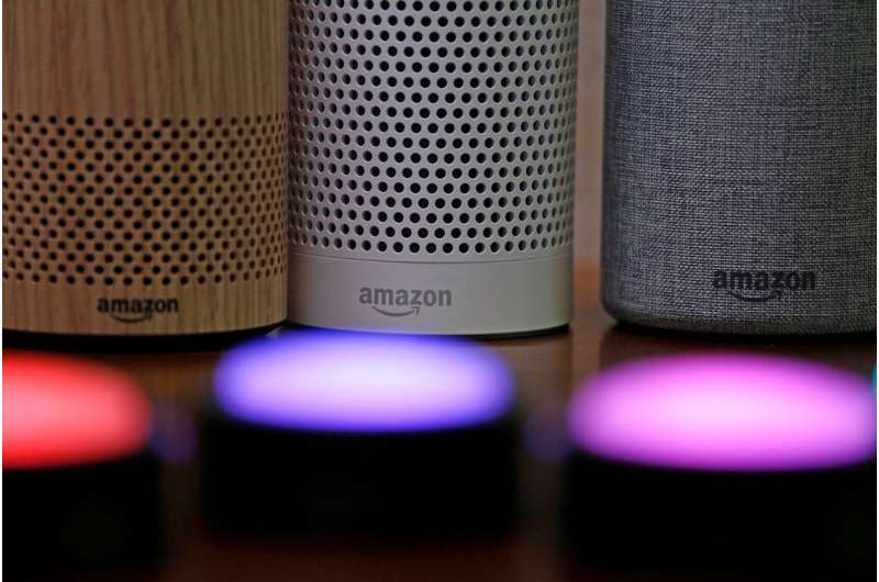 Amazon Echo and Echo Plus devices, behind, sit near illuminated Echo Button devices, Sept. 27, 2017, during an event announcing several new Amazon products by the company in Seattle. On Wednesday, Sept. 20, 2023, Amazon unveiled a slew of gadgets and an update to its popular voice assistant Alexa, infusing it with more generative AI features to better compete with other tech companies who've rolled out flashy chatbots. Credit: AP Photo/Elaine Thompson, File Amazon unveils a 'smarter and more conversational' Alexa amid AI race among tech companies