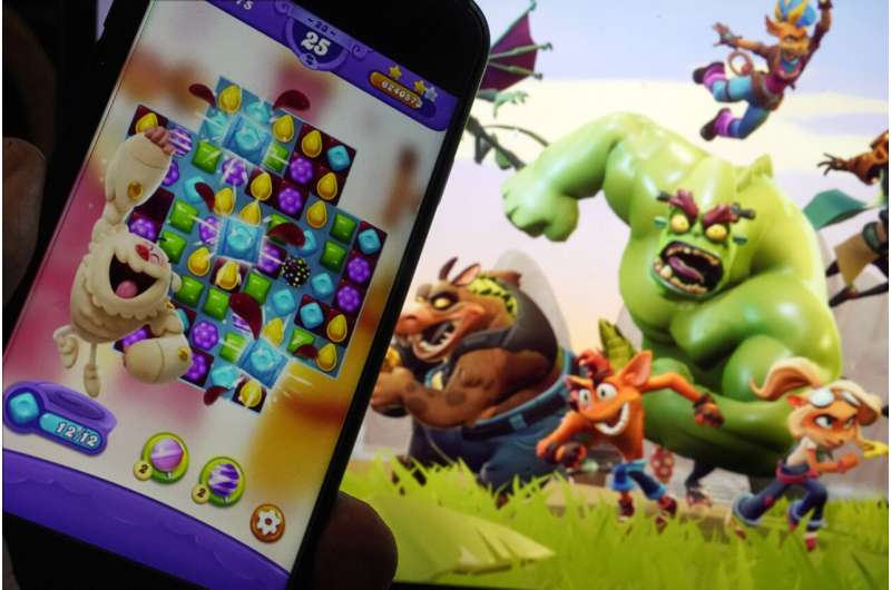 Scenes from "Candy Crush Saga," left, by Activision Blizzard, and "Crash Team Rumble," from Activision Publishing, are shown in this photo, in New York, Wednesday, June 21, 2023. Microsoft’s purchase of video game maker Activision Blizzard won final approval Friday, Oct. 13, from Britain’s competition watchdog, reversing its earlier decision to block the $69 billion deal and removing a last obstacle for one of the largest tech transactions in history. Credit: AP Photo/Richard Drew Microsoft spent two years trying to buy Activision Blizzard. For Xbox CEO, that was the easy part