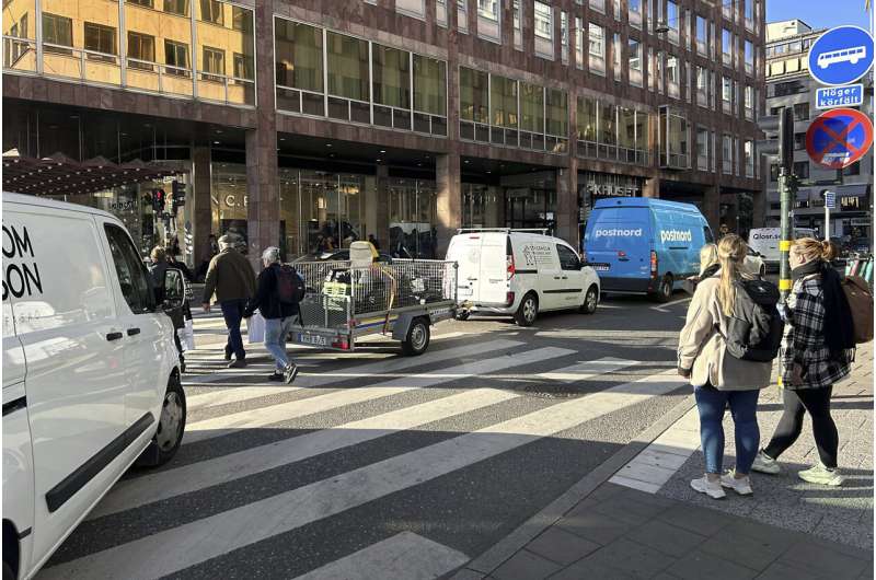 Cars drive on a road in the city center in Stockholm, Sweden, Thursday, Oct. 12, 2023. The Swedish capital plans to ban petrol and diesel cars from parts of Stockholm, gradually starting with a little-congested downtown commercial district, in an effort to curb pollution and reduce noise but also to push the technical progress toward more electric vehicles. Credit: AP Photo/Karl Ritter Stockholm to ban gasoline and diesel cars from downtown commercial area in 2025