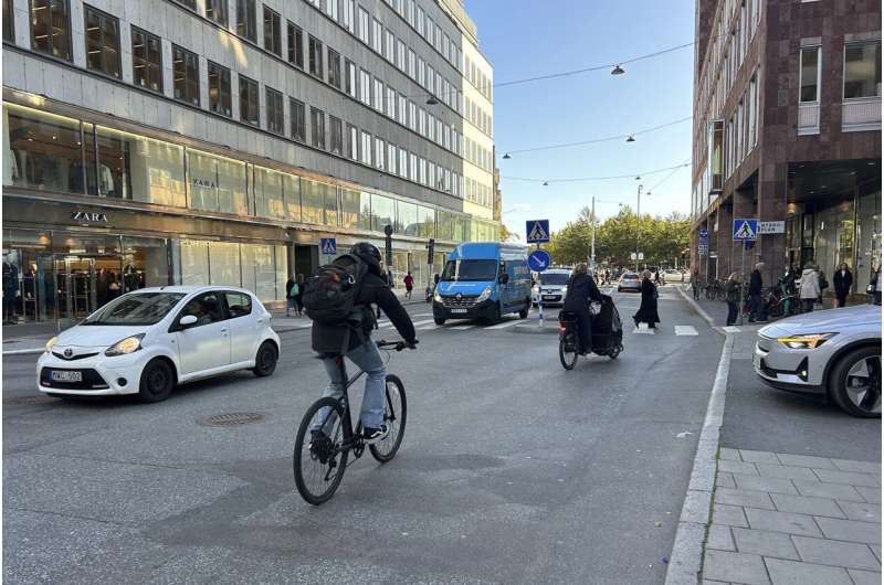 Cars drive on a road in the city center in Stockholm, Sweden, Thursday, Oct. 12, 2023. The Swedish capital plans to ban petrol and diesel cars from parts of Stockholm, gradually starting with a little-congested downtown commercial district, in an effort to curb pollution and reduce noise but also to push the technical progress toward more electric vehicles. Credit: AP Photo/Karl Ritter Stockholm to ban gasoline and diesel cars from downtown commercial area in 2025
