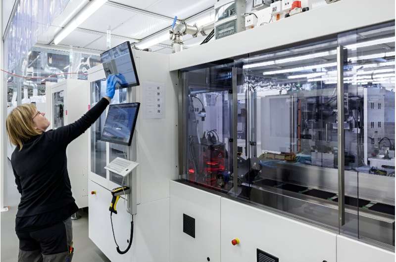 The manufacturing of solar cells is largely automated, with employees monitoring the process via computers