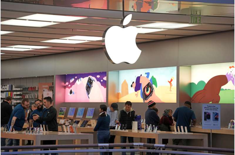 Customers shop in an Apple store in Pittsburgh Jan. 30, 2023. Apple reports earnings on Thursday, Nov. 2, 2023. Credit: AP Photo/Gene J. Puskar, File Apple's sales fall for the fourth straight quarter despite a strong start for latest iPhones