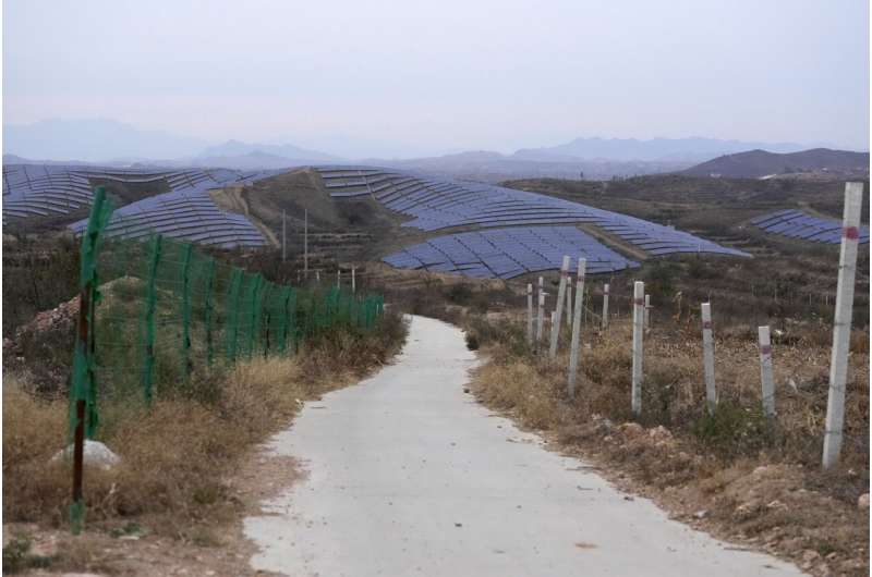 A solar farm is seen next to Donggou village near Shijiazhuang city in the northern China's Hebei province, Friday, Nov. 10, 2023. To meet the goal of limiting global warming to 1.5 degrees Celsius (2.7 degrees Fahrenheit), nine major Asian economies must increase the share of electricity they get from renewable energy from the current 6% to at least 50% by 2030, according to a report by a German thinktank released Wednesday, Nov. 15, 2023. Credit: AP Photo/Ng Han Guan Asian economies must ramp up wind and solar power to keep global warming under 1.5C, report says