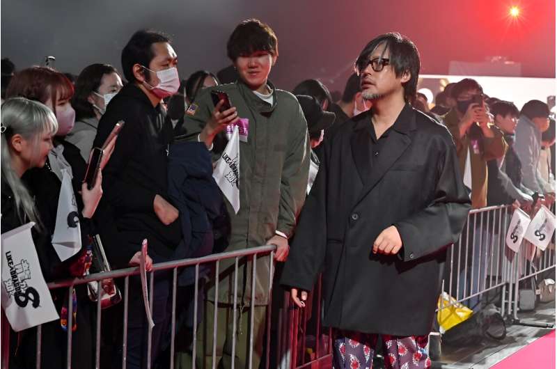 Masayoshi Yokoyama (R) says it is 'imperative' to think about the impact of violent video games on society. Masayoshi Yokoyama (R) says it is 'imperative' to think about the impact of violent video games on society