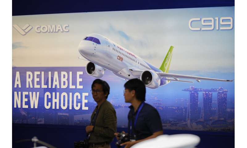 Singapore Airshow features aerial displays and the international debut of China's C919