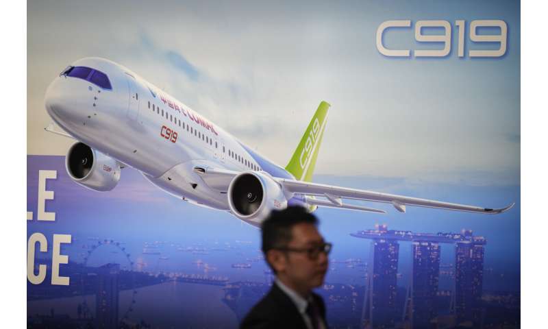 Singapore Airshow features aerial displays and the international debut of China's C919