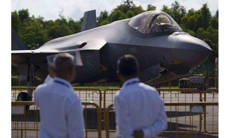Singapore Airshow features aerial displays and the international debut of China's C919