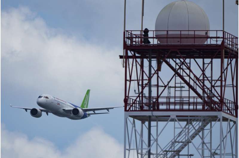 A China's COMAC C919 aircraft flies during the first day of the Singapore Airshow in Singapore, Tuesday, Feb. 20, 2024. Credit: AP Photo/Vincent Thian Singapore Airshow features aerial displays and the international debut of China's C919