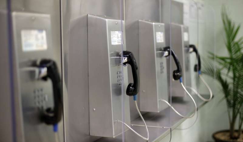 A bank of phones are seen at the Karnes County Residential Center, Thursday, July 31, 2014, in Karnes City, Texas. Federal officials gave a tour of the immigration detention facility that has been retooled to house adults with children who have been apprehended at the border. As Thursday, Feb. 22, 2024, cell phone outage shows, sometimes landline telephones can come in handy, and were suggested as part of the alternatives when people's cell phones weren't working. Credit: AP Photo/Eric Gay This week's cellphone outage makes it clear: In the United States, landlines are languishing